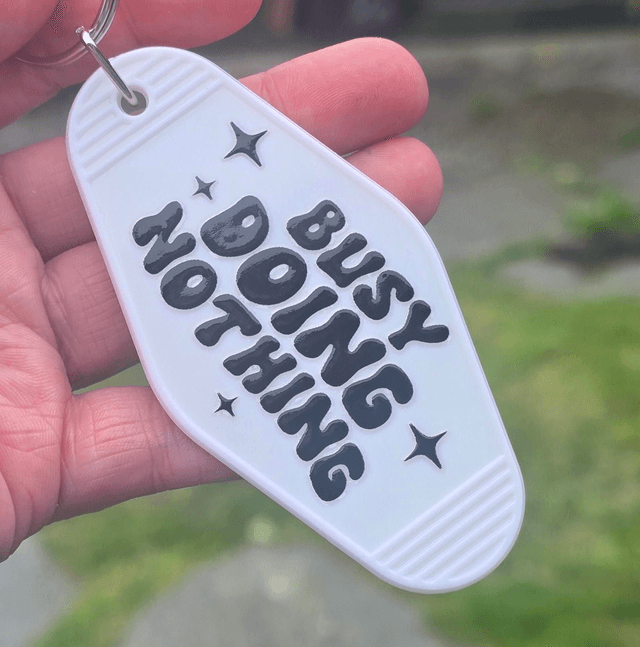 Busy Doing Nothing Motel Keyring